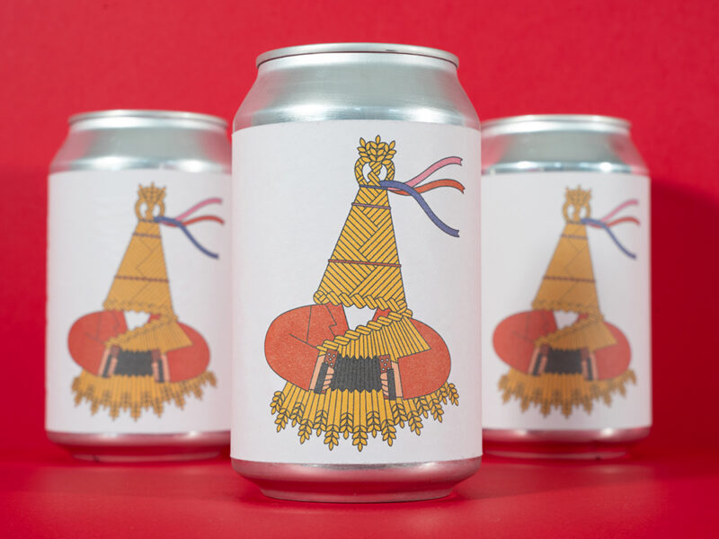 Illustrated beer cans designed by Lydia Hughes for Hopfully Brewing Co. x Illustrators Ireland collaboration, displayed against a red background.